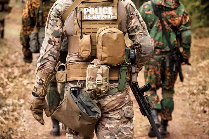 Tactical officers in camouflage gear walking on a forest trail