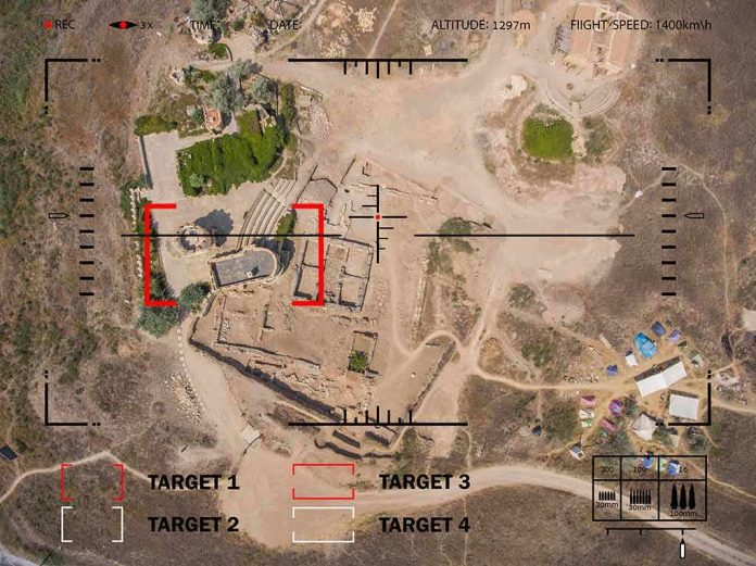 shutterstock_500925580 Aerial view through drone HUD of archaeological ruins and surrounding campsite