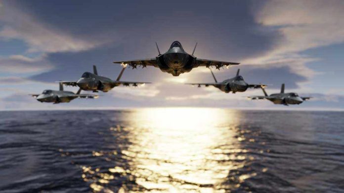 1593281419 Five jets flying low over the ocean at sunset.