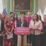 Signing new abortion law, Healey cites stories of 'anguish and heartache'