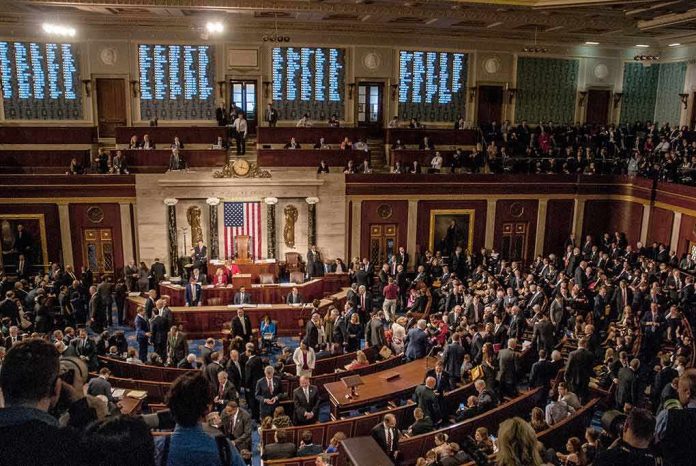 shutterstock_1186368289 House chamber filled with lawmakers and staff