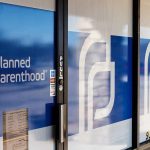 Planned Parenthood clinic entrance with blue logo panels