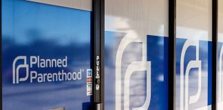 Planned Parenthood clinic entrance with blue logo panels