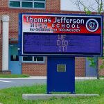 Confidential Classrooms: Parents Kept In The Dark Electronic school marquee in front of a brick high school