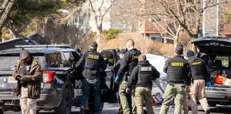 814 Devices, Chilling Trail Uncovered Police and sheriff officers gather around vehicles on a suburban street