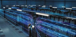 AI Data Centers Are Coming for MORE Electricity Technician with laptop in a large data center aisle