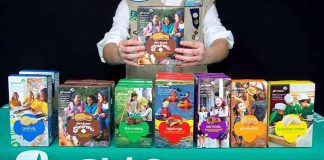 Girl Scouts Introduces ‘PILLARS OF ISLAM’ Badges Girl Scout displays assorted cookie boxes on a table