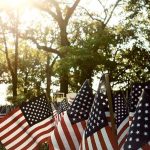 Police Veterans Draw Line At 9/11 Rites American flags displayed outdoors at a memorial