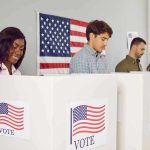 Voters casting ballots at polling booths