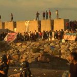 Ceuta residents destroy migrant beach camp as tensions rise in Spain