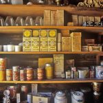 Vintage pantry shelves filled with tins and boxes