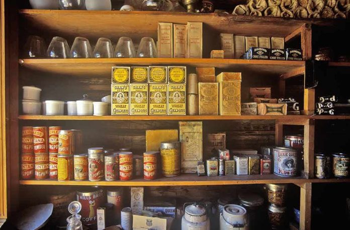 Vintage pantry shelves filled with tins and boxes