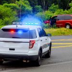 5 Killed in Northern Michigan Rampage, Girl Survives Police SUV with flashing lights at roadside crash scene