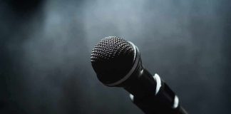 Plagiarism Bomb Hits Miley’s New Track Microphone on a stand against a dark blurred background