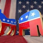 Democratic donkey and Republican elephant symbols on American flag backdrop