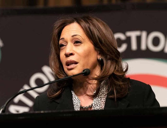 Kamala Harris speaking at a podium with a microphone