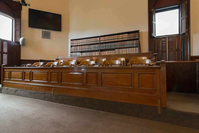 shutterstock_1589332936 jury box in an empty courtroom