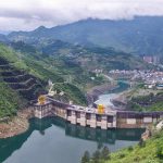 Hydroelectric dam in a green mountain valley