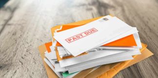 Stack of mail with past due notice on top