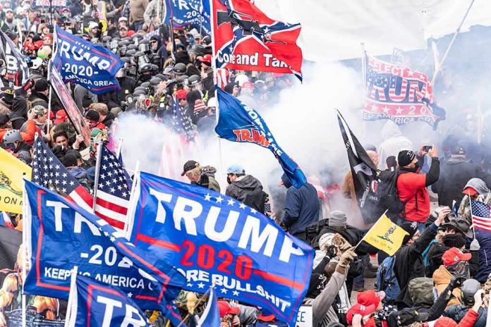 shutterstock_1889190964 Crowd with flags and smoke; Dontrelle Inman, Eugene Sims, and Walter Jones among participants