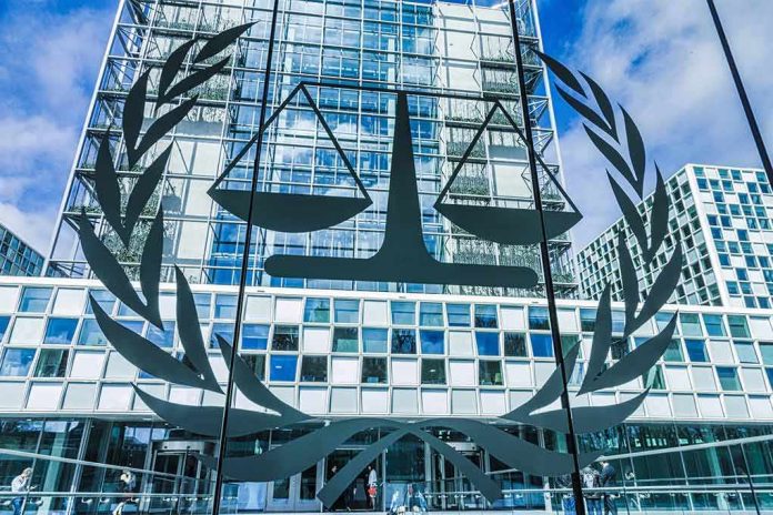 Scales of justice emblem on glass facade of modern office building
