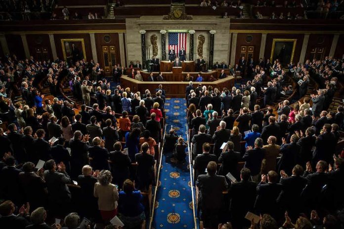shutterstock_218485888-1 Legislative chamber audience stands and applauds