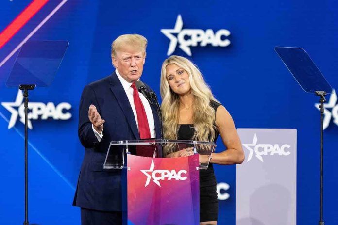Two speakers at a conference podium on a blue stage