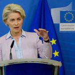 Speaker at podium during EU press conference