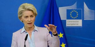 Speaker at podium during EU press conference