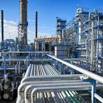 World Has Lost 2.6 Billion Barrels of Oil in Historic Supply Shock Industrial refinery with pipelines and distillation towers under blue sky