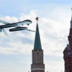 Ukraine’s Elite Drone Unit Brings War to Moscow military drone flying near ornate red-brick towers