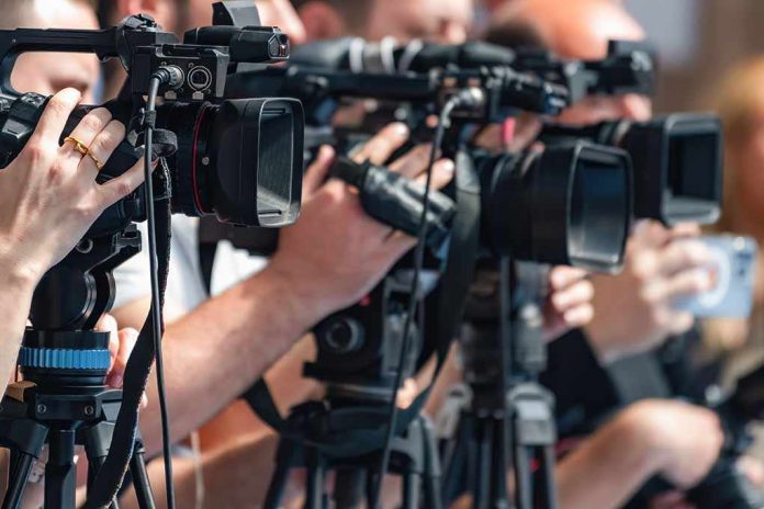 shutterstock_2692761619-2 television cameras on tripods at a media event