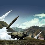 mobile missile launcher firing in mountain landscape
