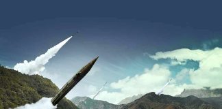 mobile missile launcher firing in mountain landscape
