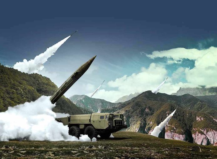 mobile missile launcher firing in mountain landscape