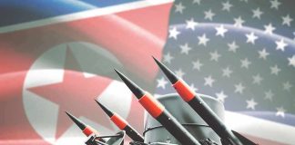 Missile launcher against North Korea and United States flags