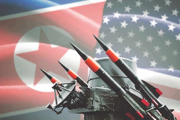 Missile launcher against North Korea and United States flags