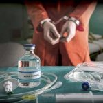 Whacko Democrat DEMANDS Free Transgender Treatments for Illegal Aliens Medical vials and IV lines on a table with a handcuffed person in the background
