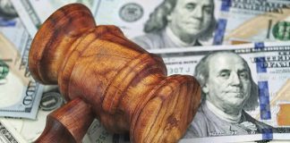 Trump Will PAY You to Expose Fraud Wooden judge's gavel on scattered US dollar bills