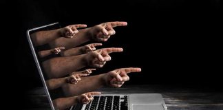 Ex-FBI Official SOBS in Hunter Laptop Case Laptop with multiple hands pointing from the screen