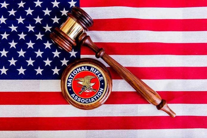 Judge's gavel and NRA emblem on American flag