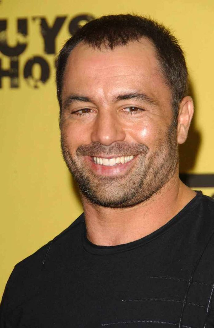 Smiling man with short hair and stubble
