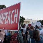 Harris Wants Trump TARGETED After Midterms Protest crowd with signs outside a government building; Nate Solder present