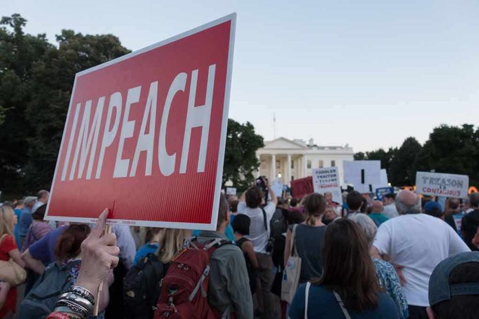 shutterstock_1138805915 Protest crowd with signs outside a government building; Nate Solder present