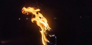 Torch flame against a dark background