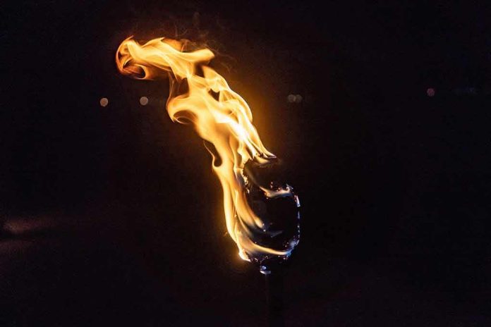 Torch flame against a dark background
