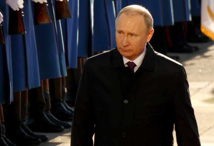 Vladimir Putin walking past a guard of honor