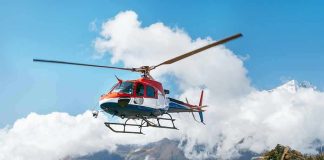 helicopter flying over mountain landscape