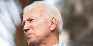 older man speaking into a microphone