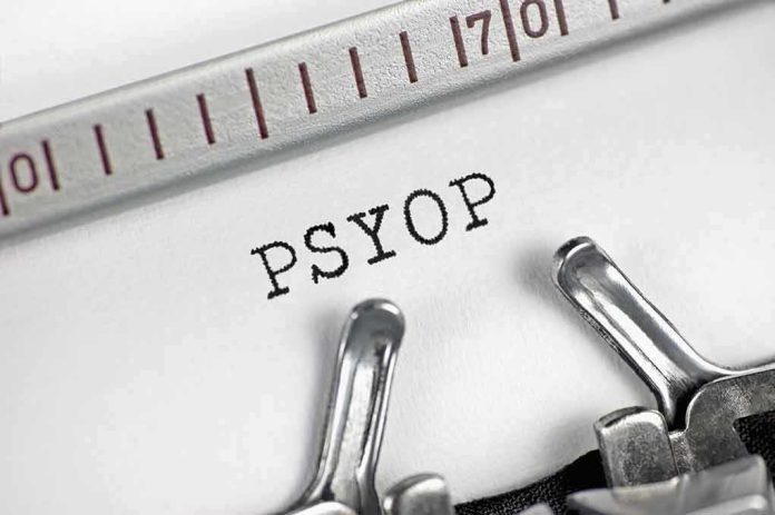 Typewriter typing the word PSYOP on white paper